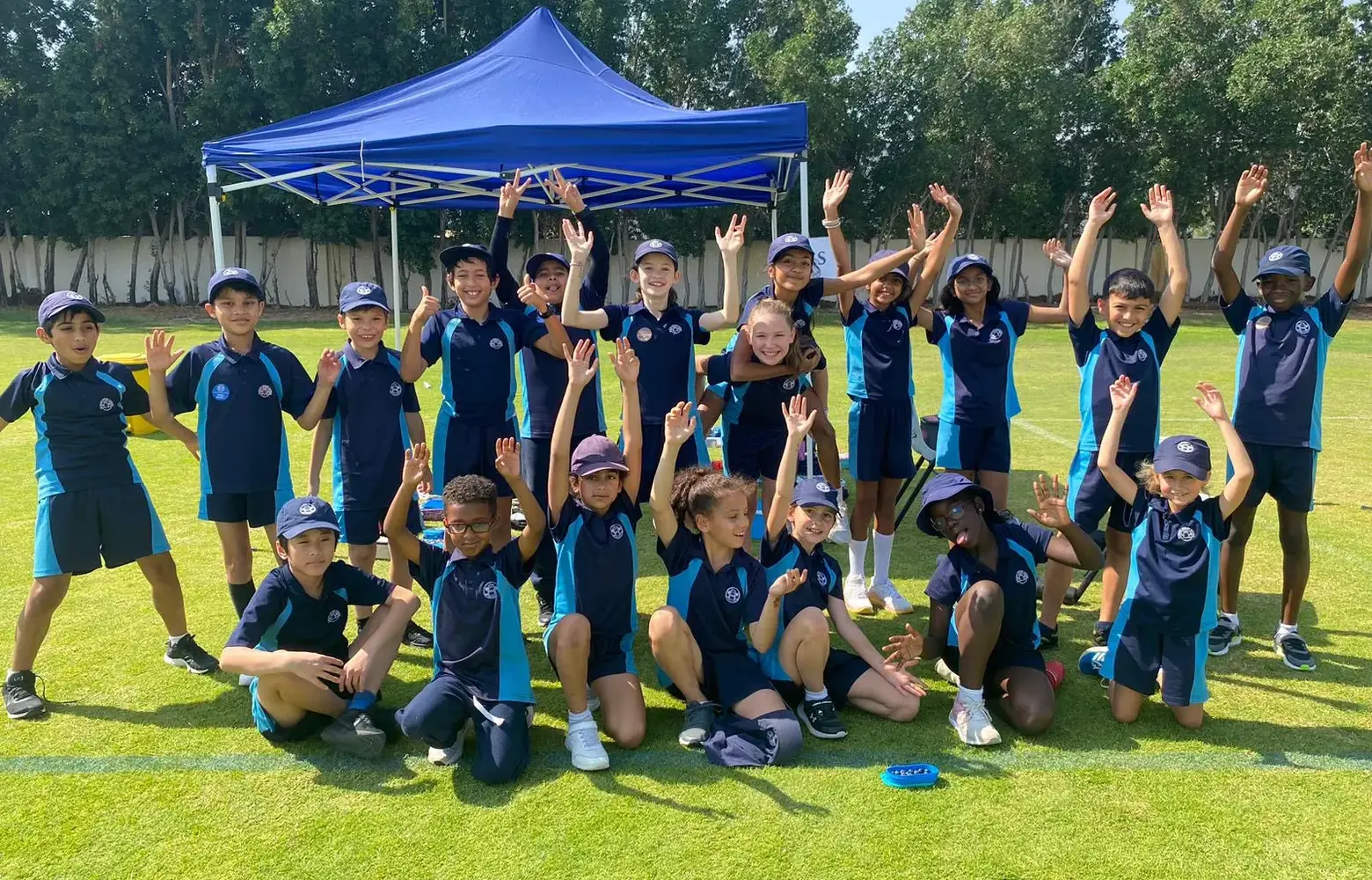 Group of pupils in PE kit outside